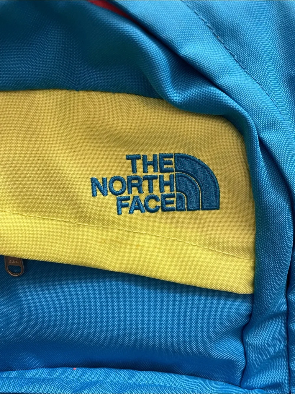The North Face Blue and Lime 'Wise Guy' Backpack with Red Accent